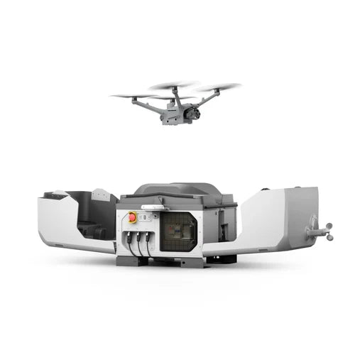 DJI Dock 3 with wings deployed and the aircraft airborne above the docking station