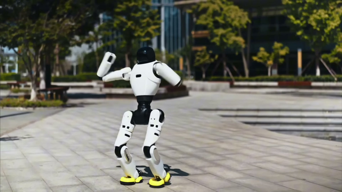 AgiBot X2 humanoid robot walking across an outdoor public plaza