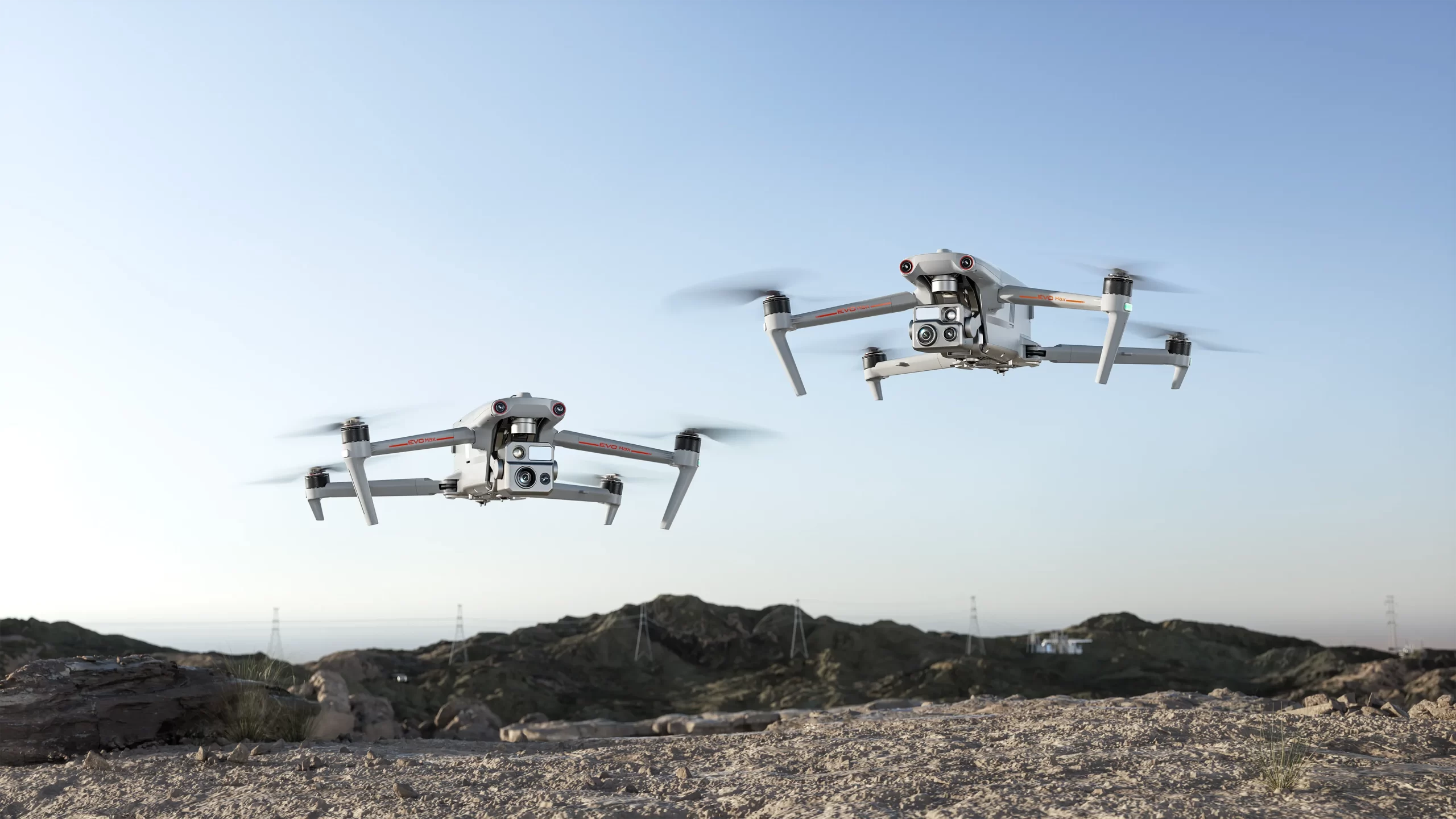 Autel EVO Max drones over rugged ridge at dusk - Autel Robotics collection banner