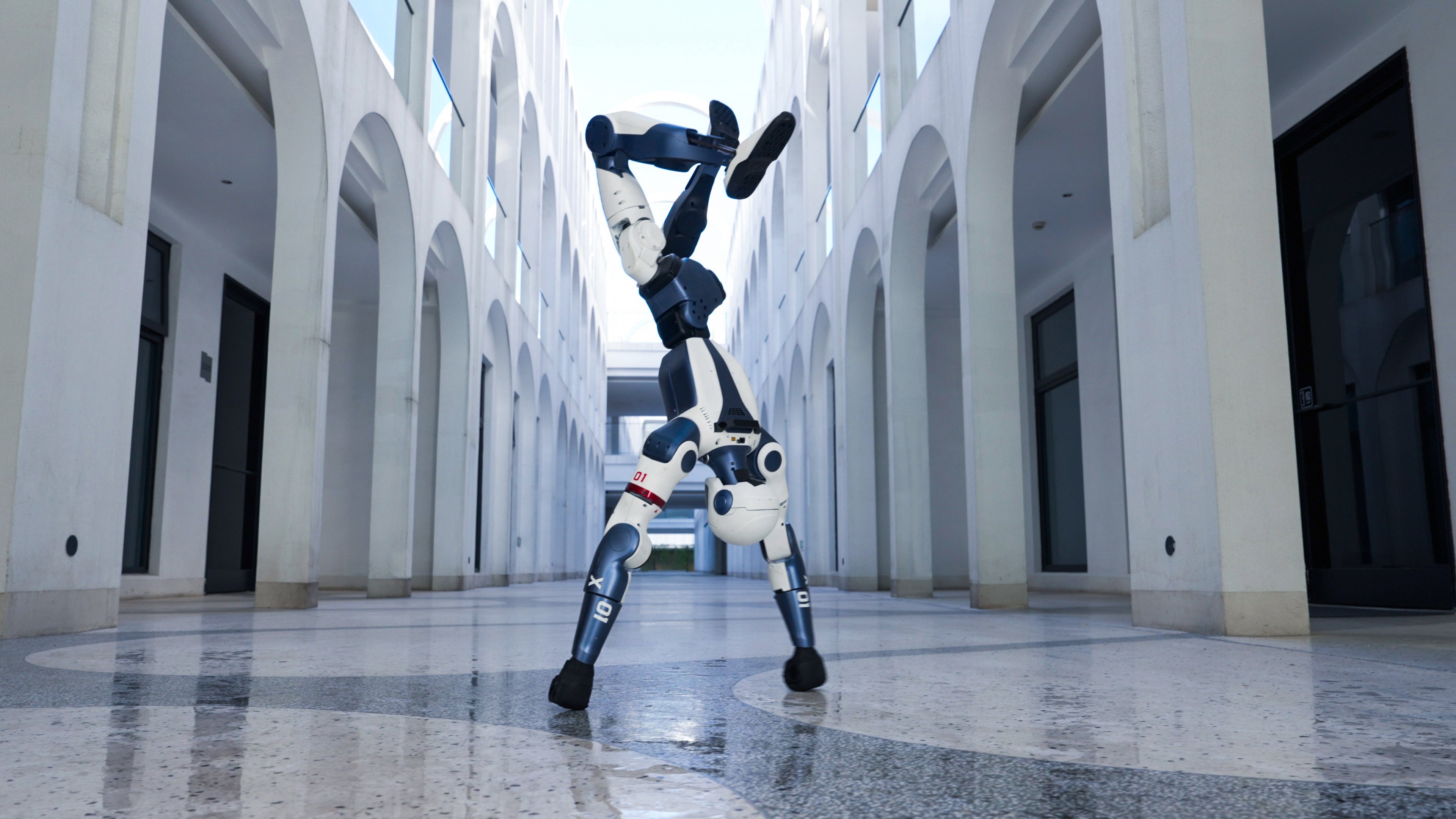 Unitree R1 humanoid robot performing a handstand