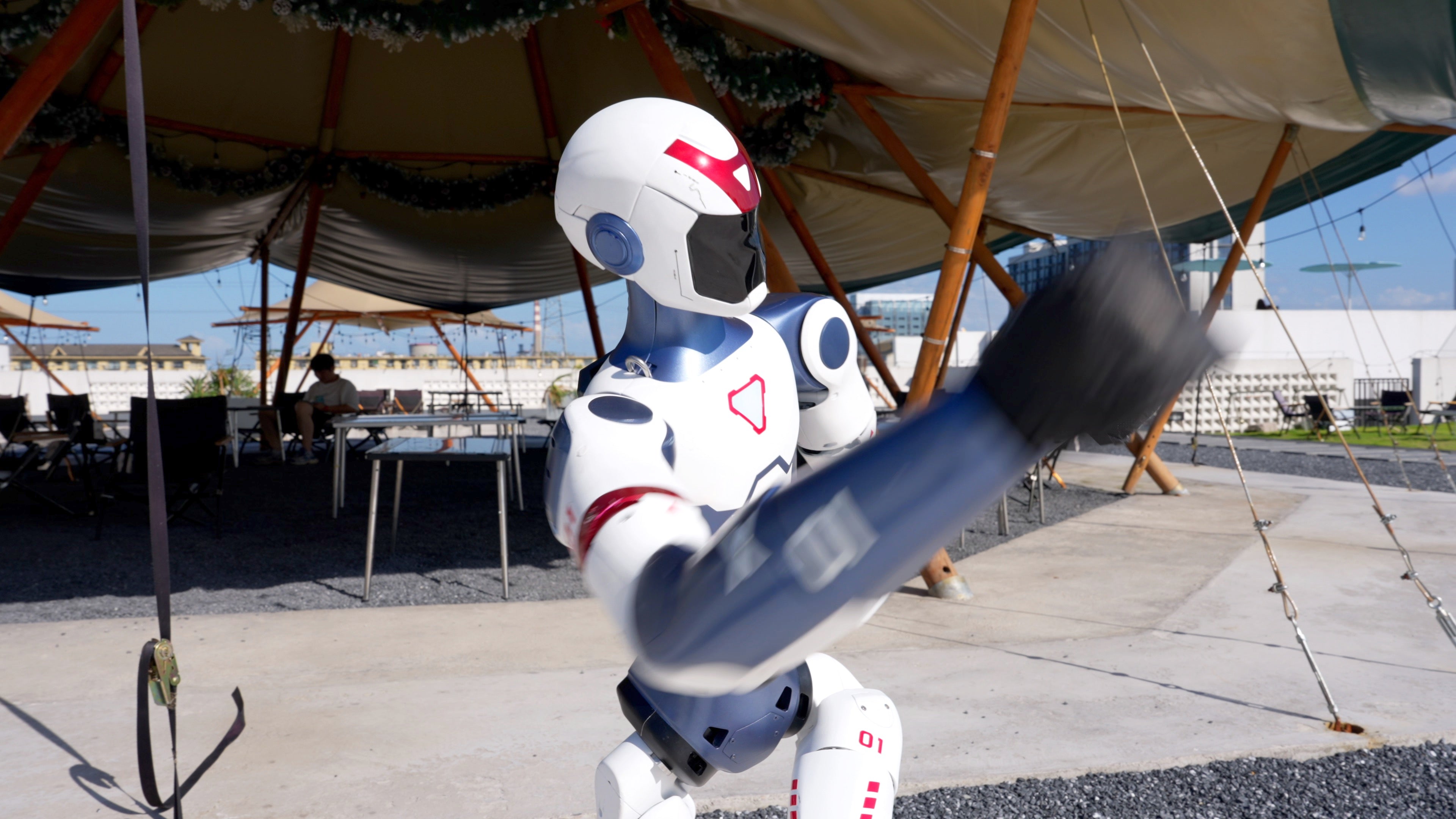 Unitree R1 humanoid robot throwing a punch, dynamic motion