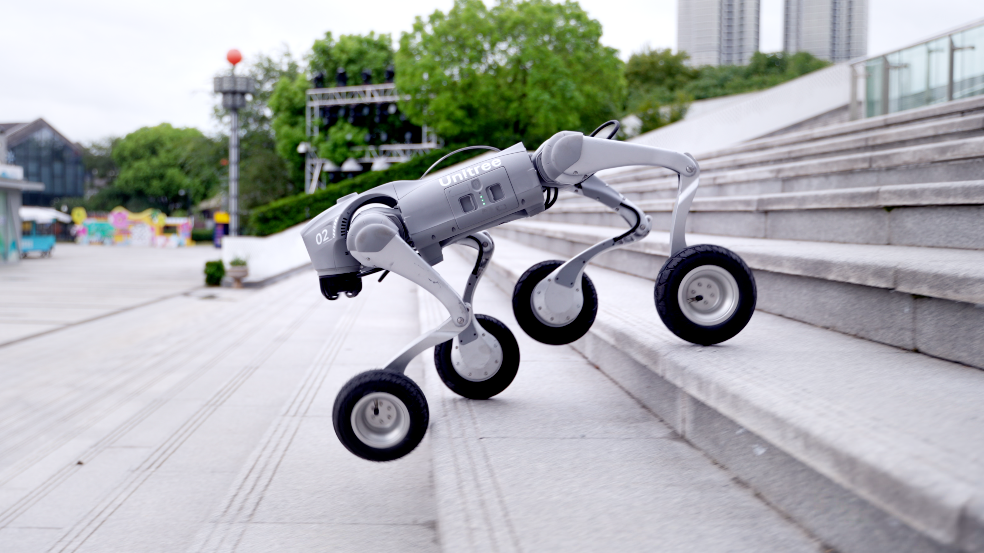 Unitree Go2-W wheeled quadruped robot, 4K render side angle