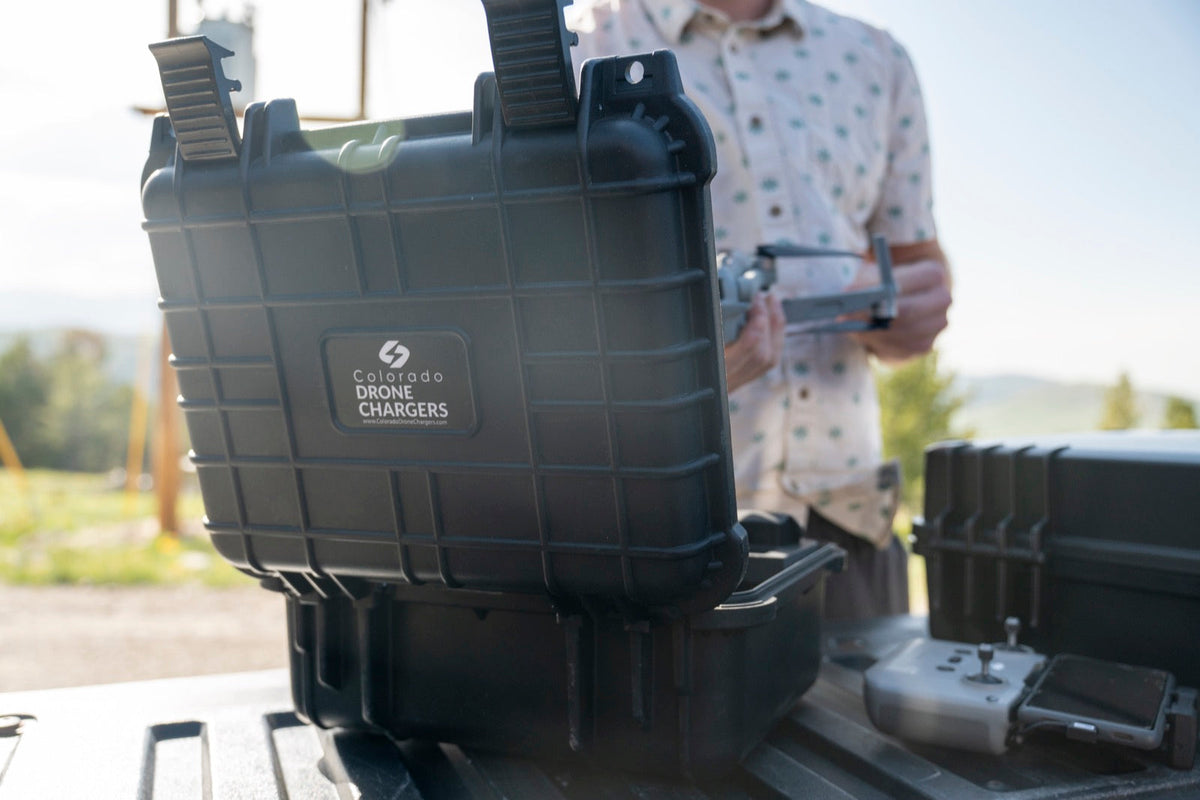 Colorado Drone Chargers PRCS rapid charger open on a truck tailgate at a field launch site