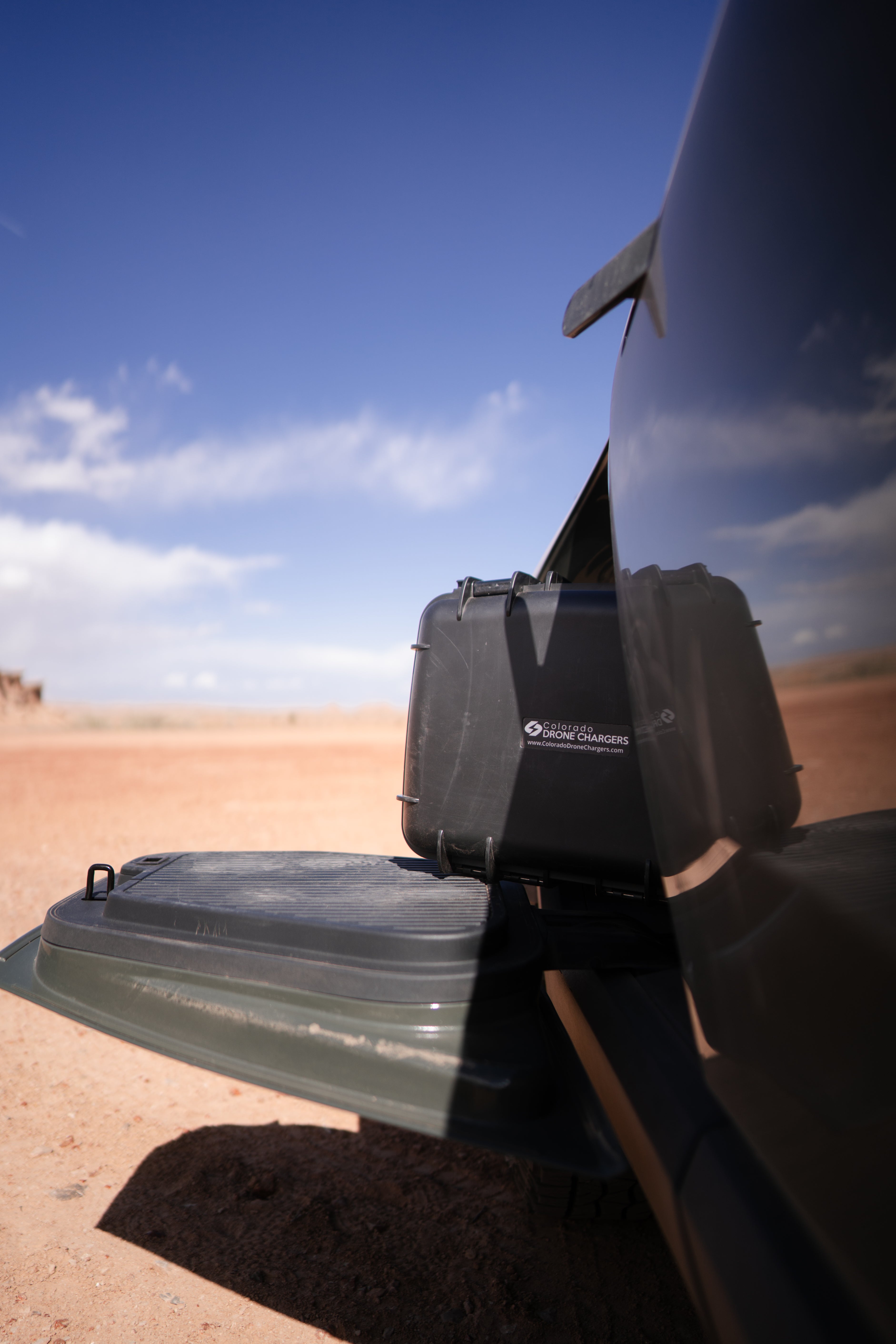Charging drone batteries in the field from a vehicle with a Colorado Drone Chargers rapid charging system