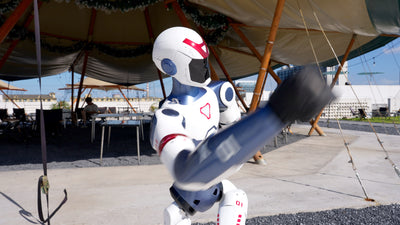 Unitree R1 humanoid robot throwing a punch, dynamic motion