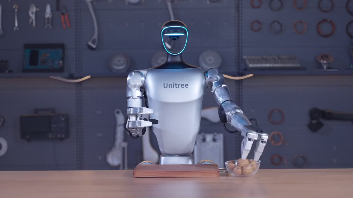 Load video: Unitree G1 humanoid robot manipulating objects on a bench