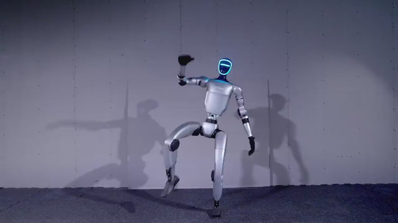 Unitree G1 humanoid robot balancing and moving outdoors