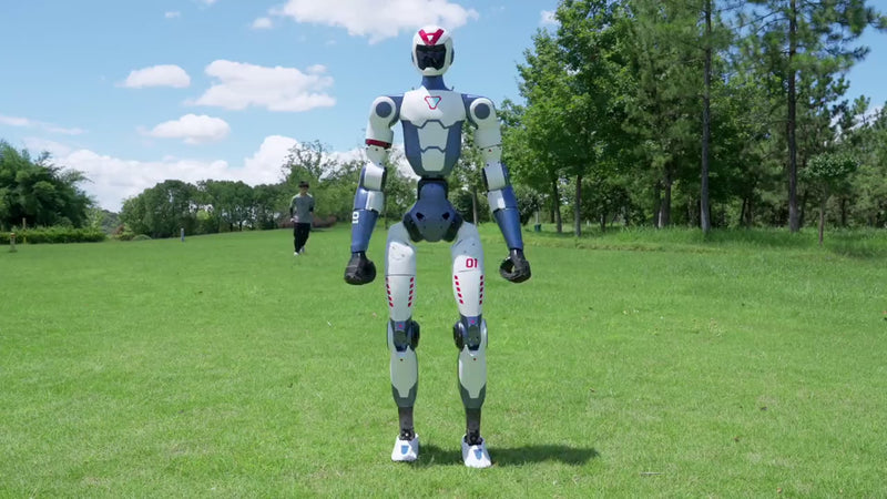 Unitree R1 humanoid robot doing a handstand on grass