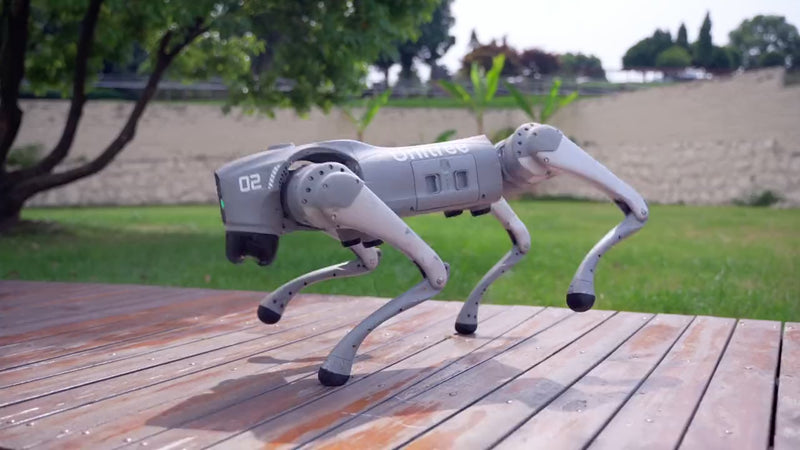 Unitree Go2 Pro quadruped robot leaping off a deck onto grass