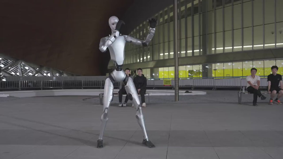 Load video: Unitree H2 humanoid robot moving dynamically outdoors on high torque joints