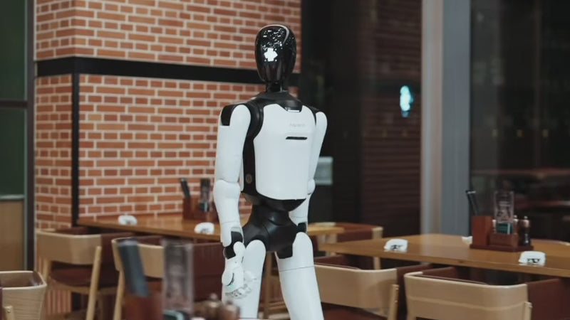 AgiBot A3 Ultra guiding a man through a hotel corridor
