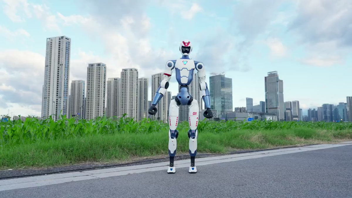 Load video: Unitree R1 humanoid robot performing a flip on a road