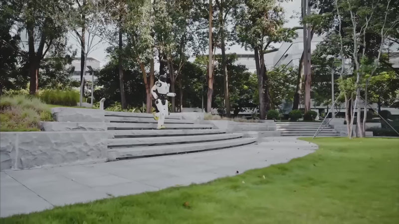 AgiBot X2 humanoid robot walking outdoors over steps and sloped terrain