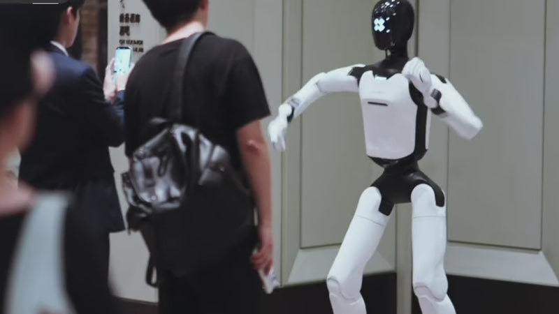 Hotel guests photographing the AgiBot A3 Ultra