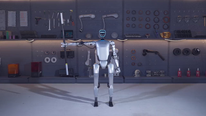 Unitree G1 humanoid robot working at a tool bench