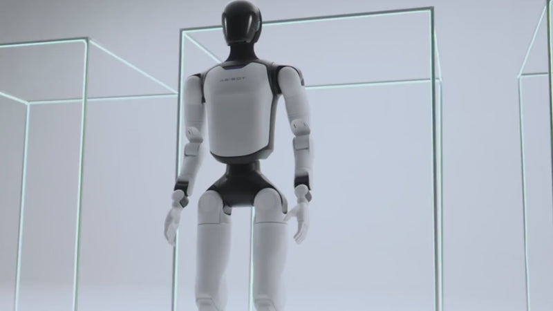 AgiBot A3 humanoid robot walking, close-up on chest badge, full-body stance and lit face display
