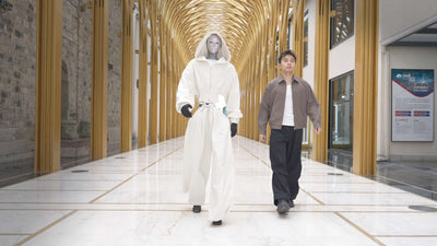 Unitree H2 Edu humanoid robot walking alongside a person